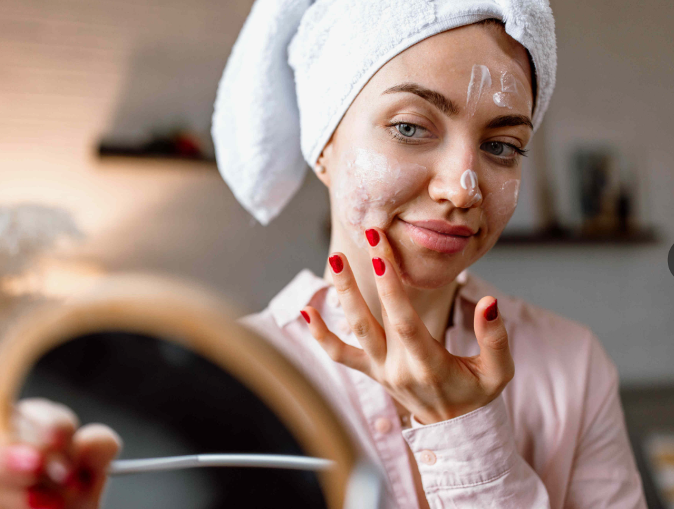 Qullnowisfap skincare products with glowing abstract energy background